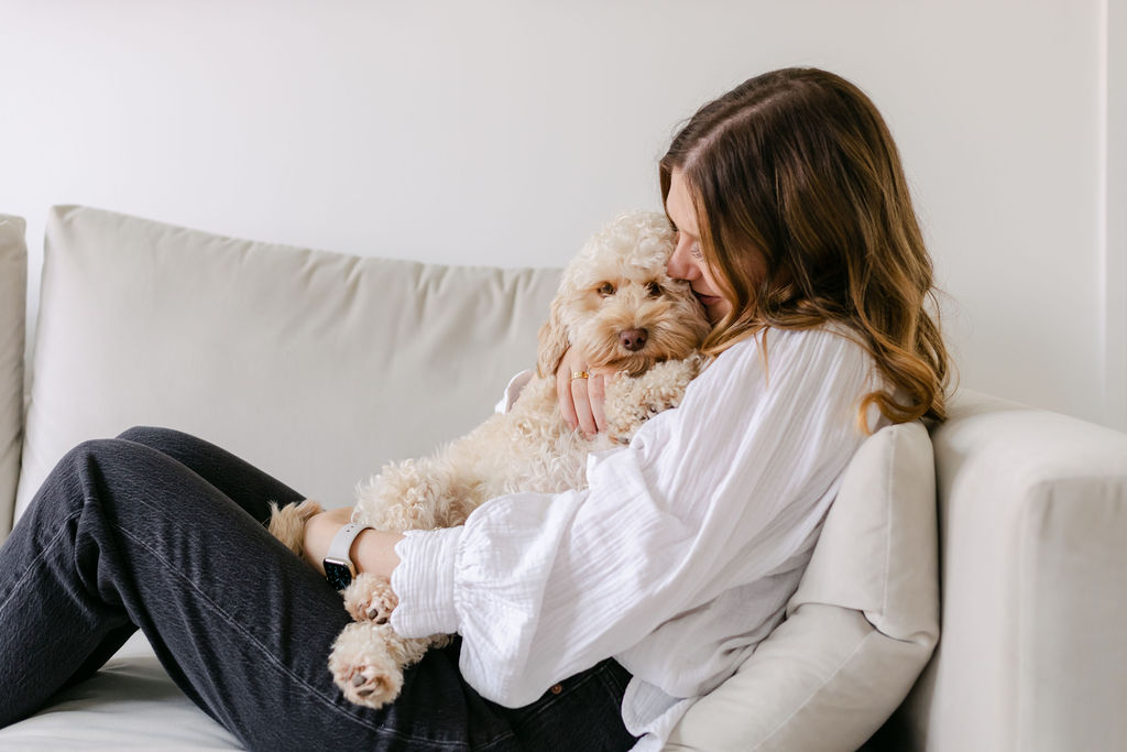 CBT Therapist Natalie Englander on sofa with dog Is Perfectionism Sabotaging Your Relationships